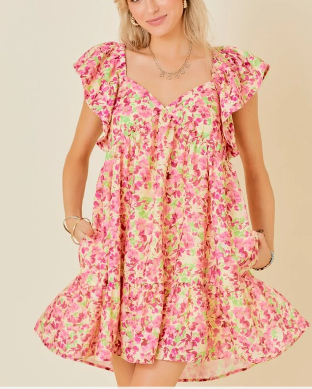 Butter Pink floral mini dress with tie back and ruffle sleeves and side pockets