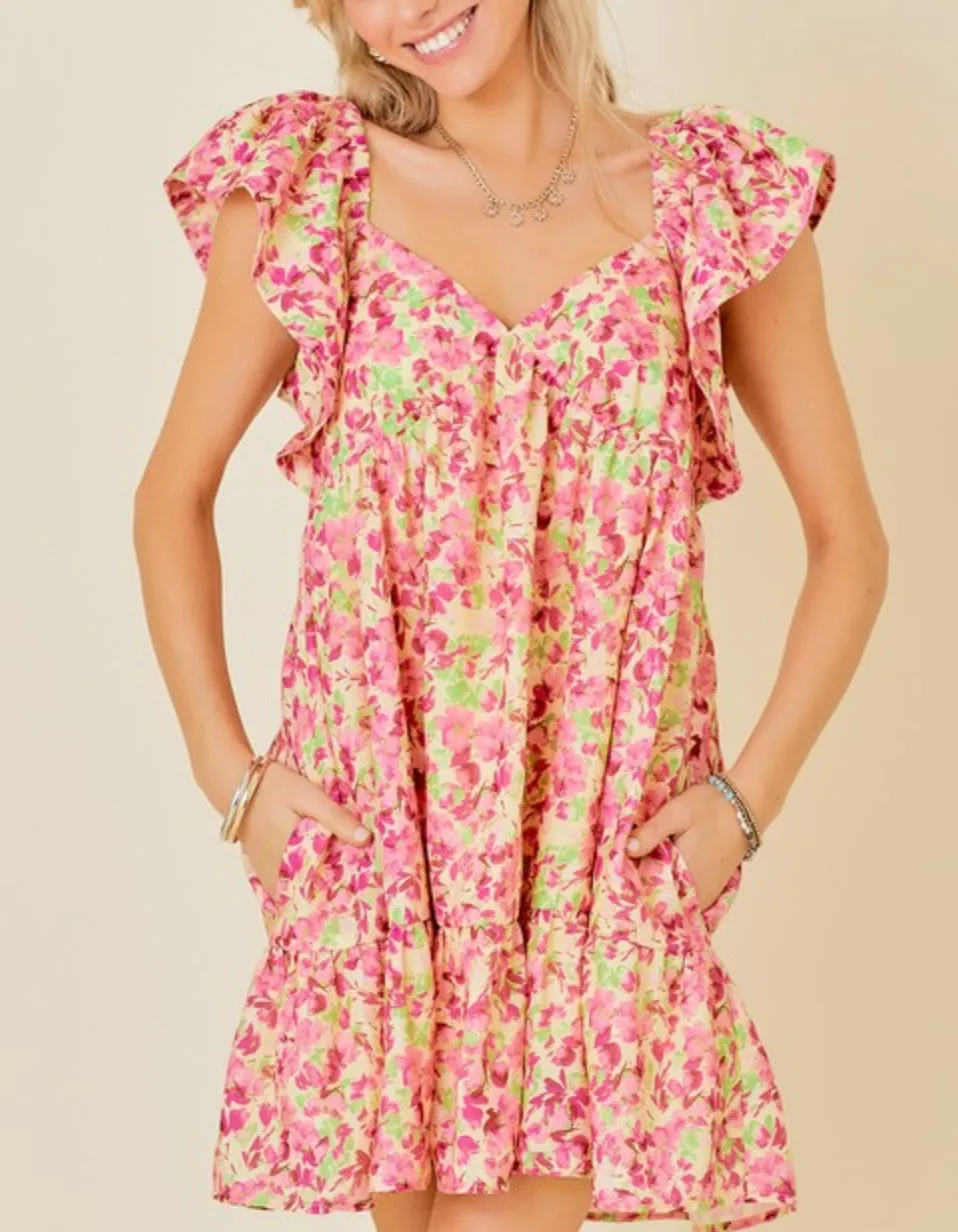 Butter Pink floral mini dress with tie back and ruffle sleeves and side pockets