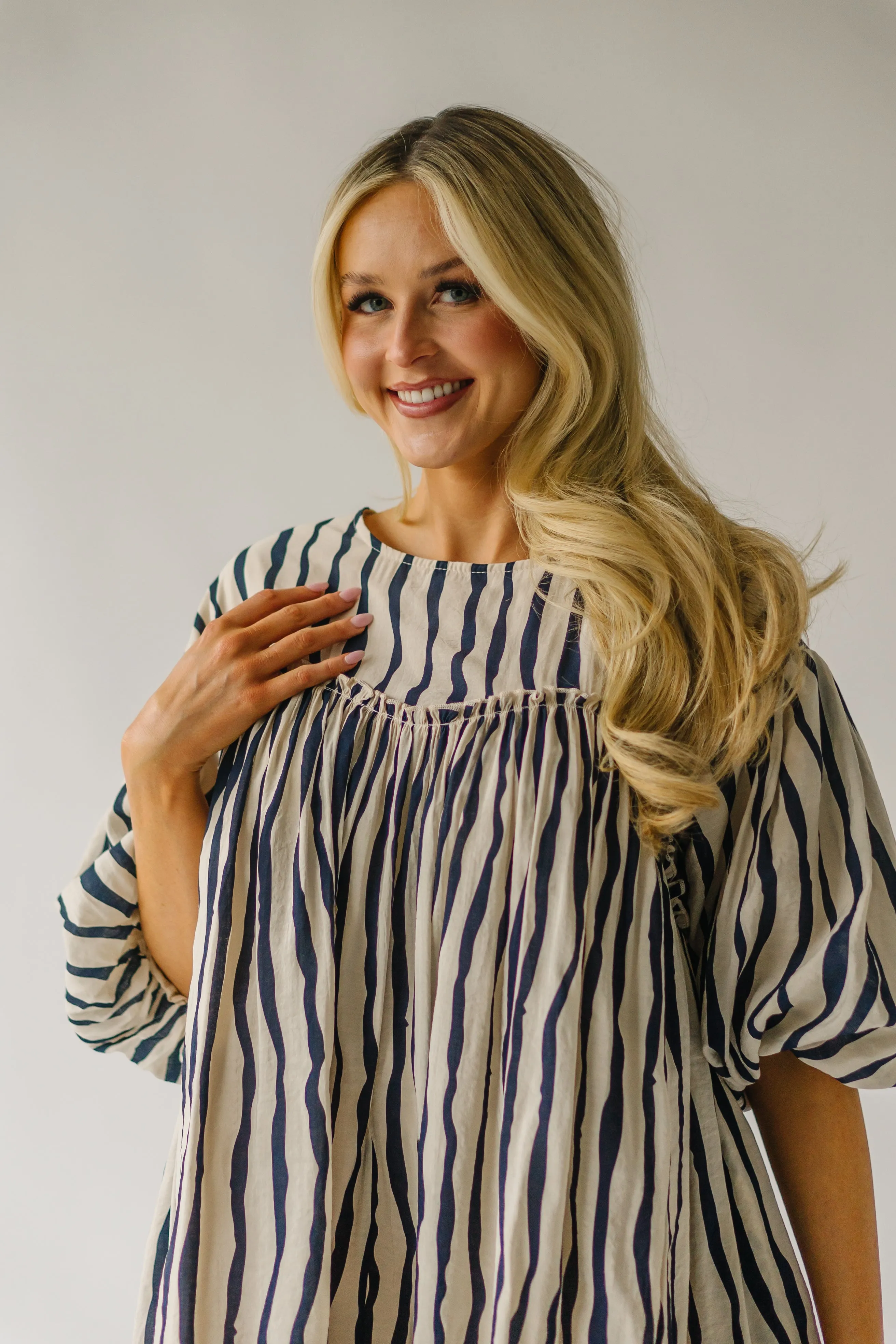 The Pampa Bubble Sleeve Babydoll Dress in Navy Stripe